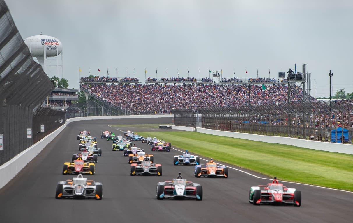 INDYCAR cars on track lining up for the start of the Indianapolis 500
