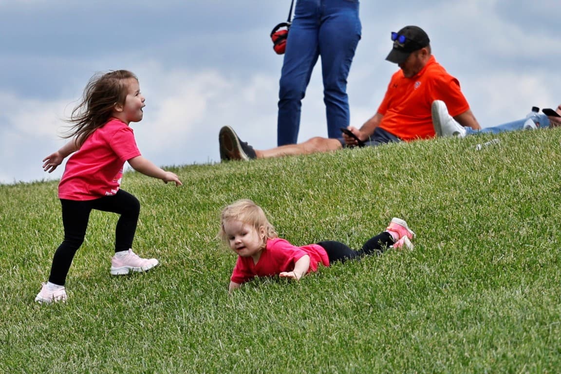 Kids playing on the mounds at the Indianapolis Motor Speedway